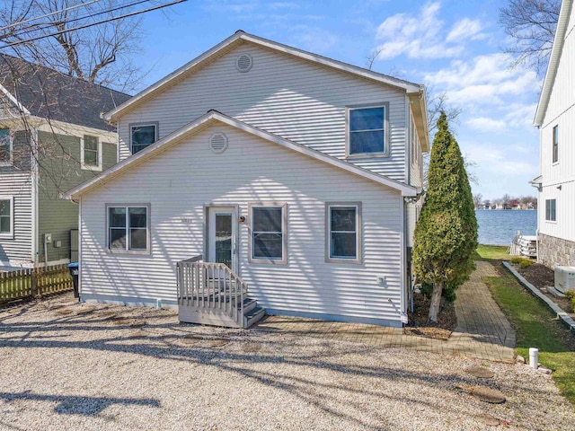 11523 N Crowdale Dr, Syracuse, IN 46567 - rear view of property with a water view and fence