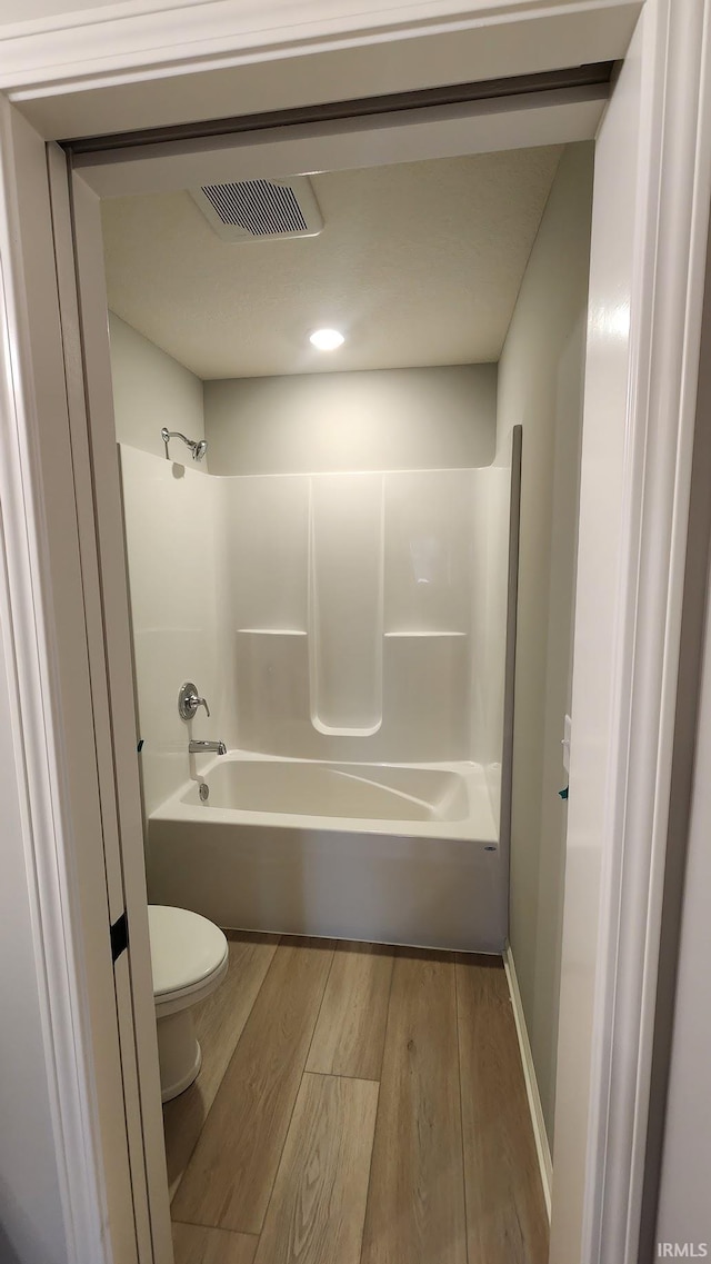 1332 Pueblo Trl, Fort Wayne, IN 46845 - full bath featuring toilet, wood finished floors,  shower combination, baseboards, and recessed lighting