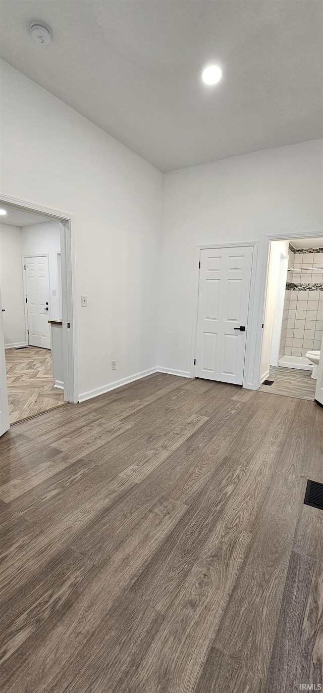 910 Harriet St, Evansville, IN 47710 - empty room featuring baseboards, recessed lighting, and wood finished floors