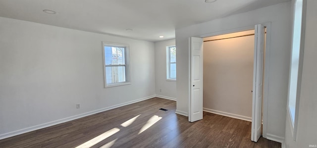 910 Harriet St, Evansville, IN 47710 - unfurnished bedroom with dark wood-type flooring, visible vents, baseboards, and recessed lighting