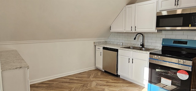 910 Harriet St, Evansville, IN 47710 - kitchen featuring a sink, white cabinetry, baseboards, and stainless steel appliances