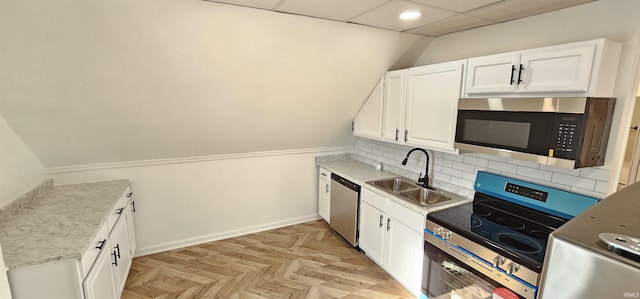 910 Harriet St, Evansville, IN 47710 - kitchen with appliances with stainless steel finishes, baseboards, white cabinetry, decorative backsplash, and a sink