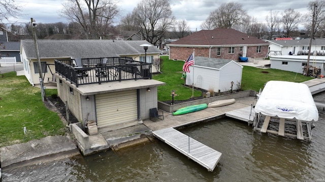 10509 N Lakeview Dr, Monticello, IN 47960 - dock area with a residential view, a deck with water view, and a lawn