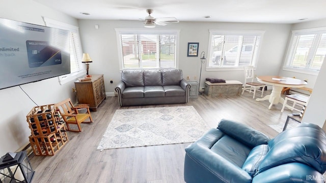 10509 N Lakeview Dr, Monticello, IN 47960 - living room featuring a ceiling fan, wood finished floors, and baseboards