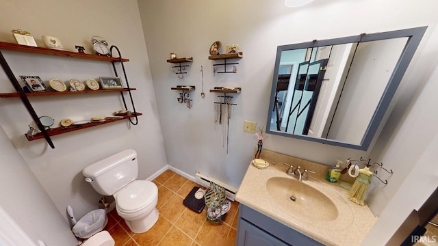 10509 N Lakeview Dr, Monticello, IN 47960 - bathroom featuring tile patterned flooring, a baseboard radiator, toilet, vanity, and baseboards