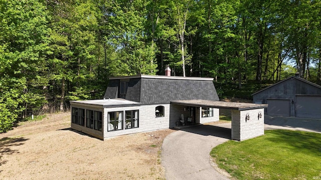 505 Longtree Ln, Logansport, IN 46947 - view of front of property featuring an outbuilding, asphalt driveway, and a shingled roof