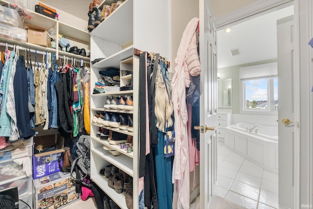 walk in closet with tile patterned flooring and visible vents