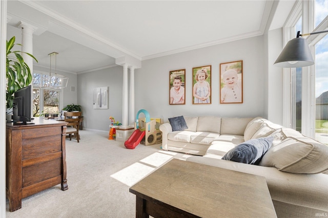 carpeted living area featuring crown molding and decorative columns