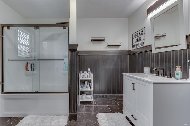 8780 N Old State Road 37th Rd, Bloomington, IN 47408 - bathroom featuring combined bath / shower with glass door, vanity, wainscoting, and marble finish floor