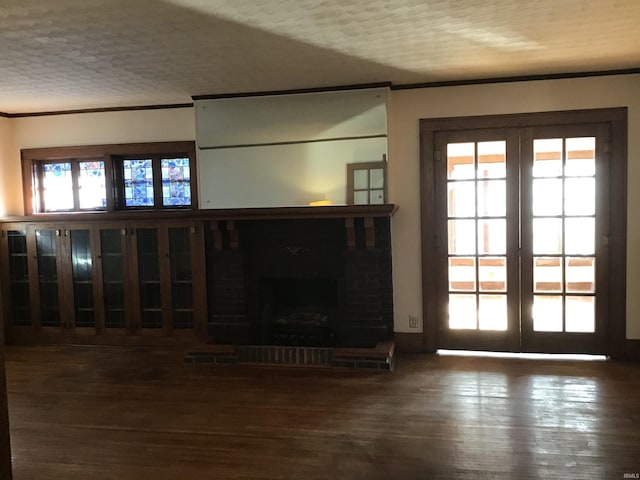 213 S Monticello St, Winamac, IN 46996 - unfurnished living room featuring french doors, crown molding, and wood finished floors