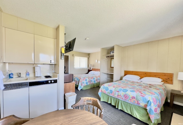 342 E Himes St, North Webster, IN 46555 - bedroom with a textured ceiling and carpet flooring