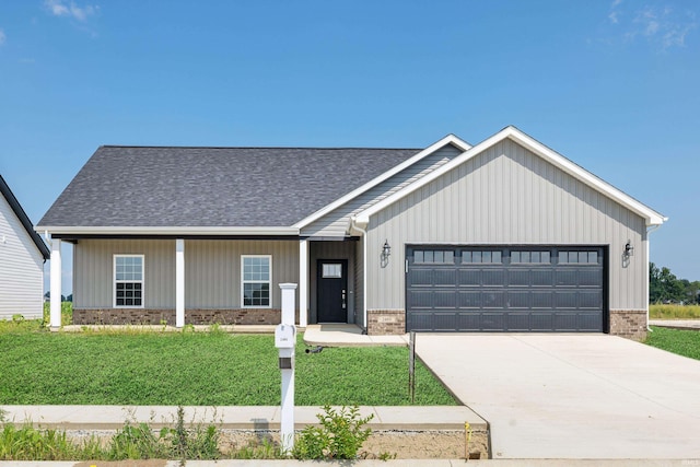 view of front facade featuring concrete driveway, an attached garage, a front lawn, brick siding, and a shingled roof