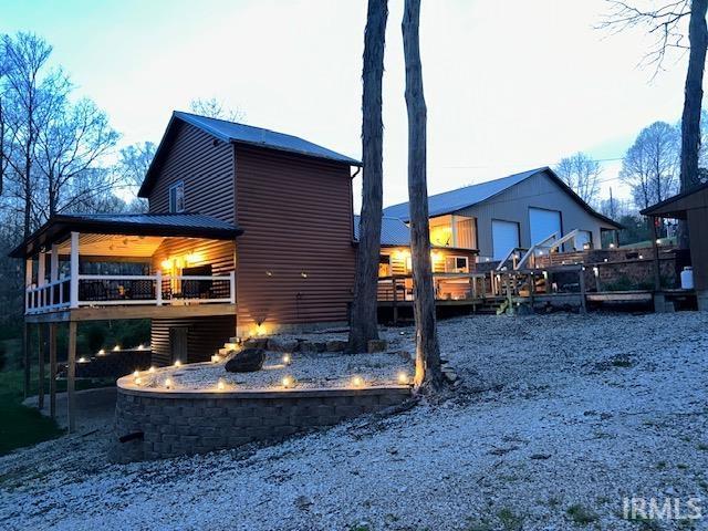 3008 Chigger Ridge Rd Unit 395, 396, Birdseye, IN 47513 - back of house featuring an outdoor fire pit and a deck