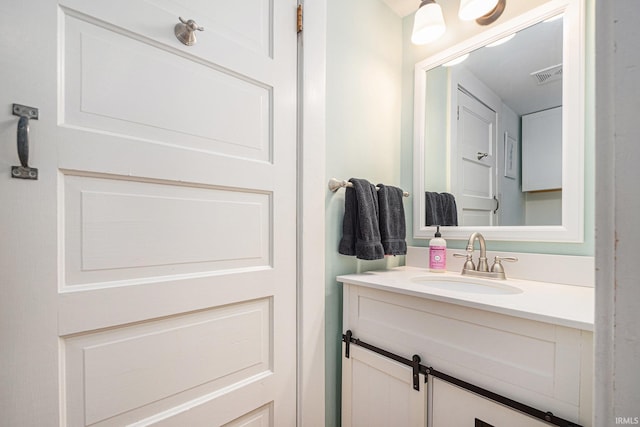 1069 Riverside Dr, South Bend, IN 46616 - bathroom featuring visible vents and vanity