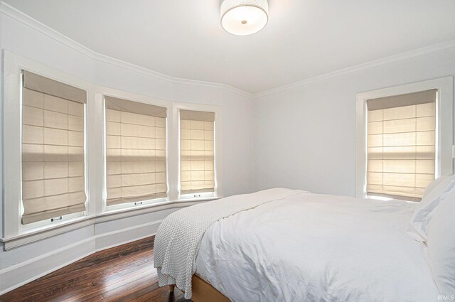 1069 Riverside Dr, South Bend, IN 46616 - bedroom with ornamental molding and wood finished floors