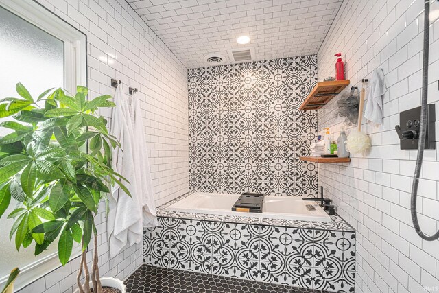 1069 Riverside Dr, South Bend, IN 46616 - full bathroom with tile patterned flooring, tile walls, tiled shower, and a relaxing tiled tub