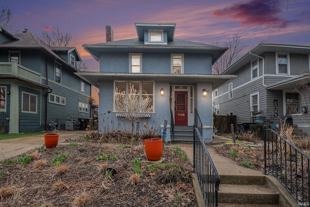 1069 Riverside Dr, South Bend, IN 46616 - american foursquare style home featuring entry steps and stucco siding