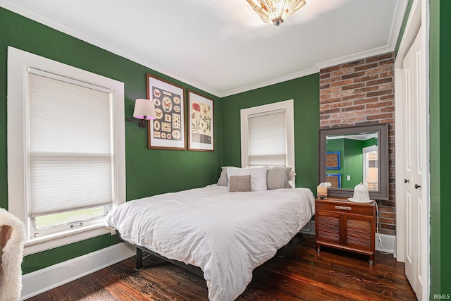 1069 Riverside Dr, South Bend, IN 46616 - bedroom with ornamental molding, baseboards, and wood finished floors