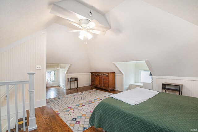 1069 Riverside Dr, South Bend, IN 46616 - bedroom featuring multiple windows, wood finished floors, vaulted ceiling, and a ceiling fan