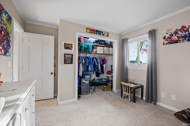 bedroom with a closet, baseboards, light colored carpet, and crown molding