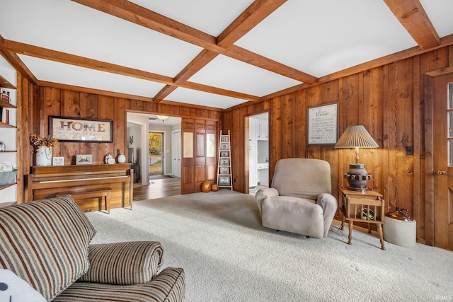 living room featuring coffered ceiling, wood walls, beam ceiling, and carpet