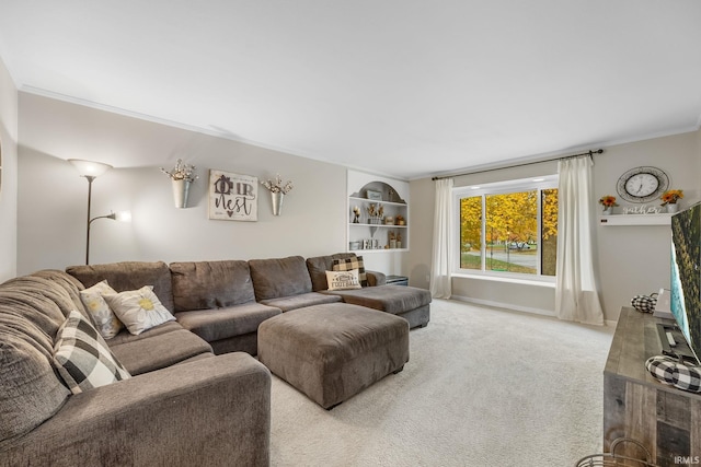 carpeted living area featuring crown molding and baseboards