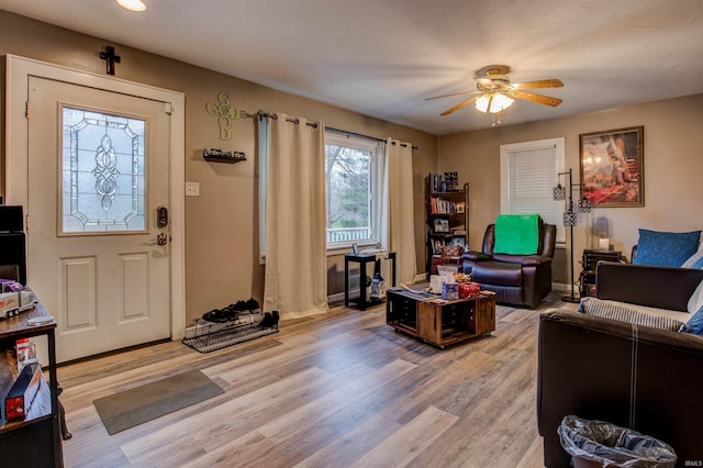 living room featuring light wood-style flooring, ceiling fan, recessed lighting, and baseboards