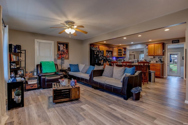 living area featuring recessed lighting, light wood-style flooring, a toaster, and ceiling fan
