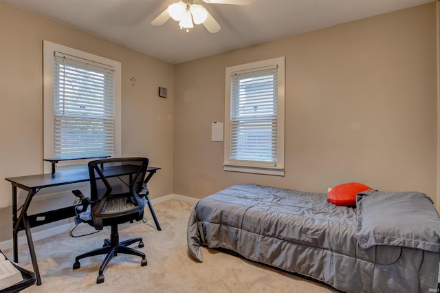 bedroom with baseboards, carpet flooring, and ceiling fan