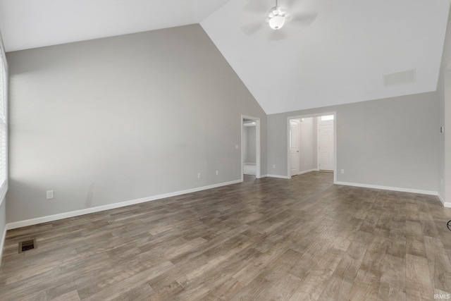 spare room featuring ceiling fan, wood finished floors, and visible vents
