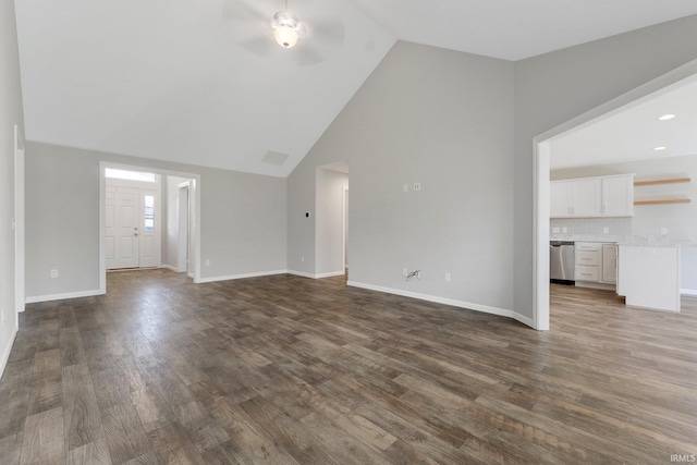 unfurnished living room featuring a ceiling fan, baseboards, and dark wood-style flooring