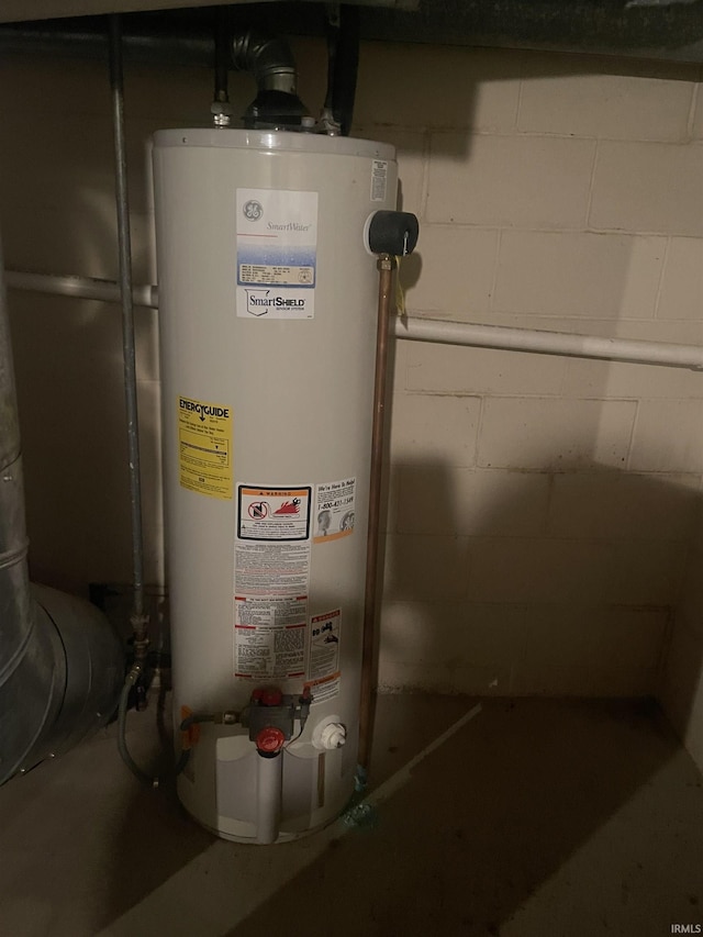 utility room featuring gas water heater