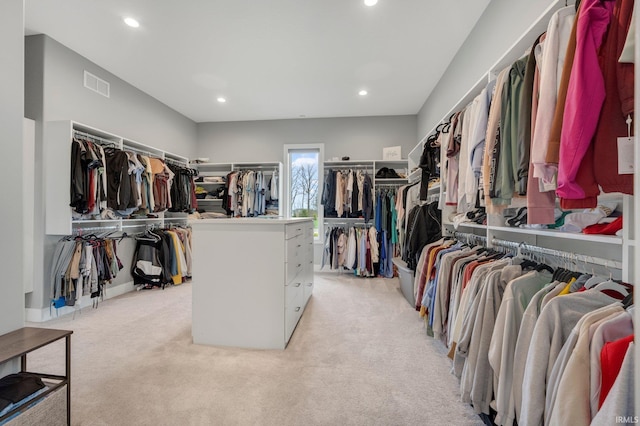 walk in closet with light carpet and visible vents
