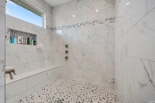 full bathroom with tiled shower