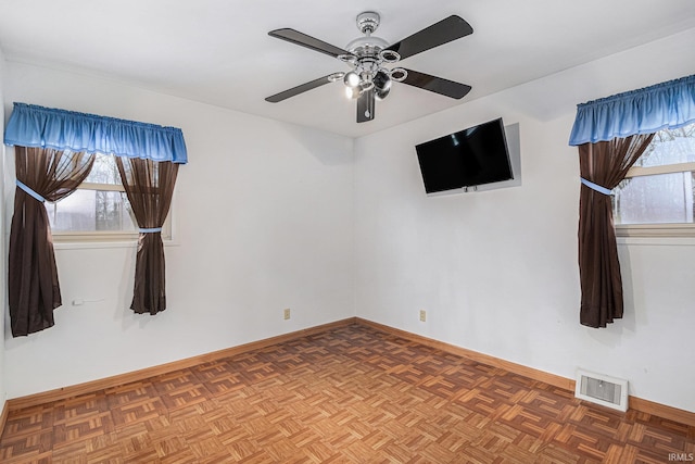 619 Widaman St, Warsaw, IN 46580 - empty room with visible vents, baseboards, and ceiling fan