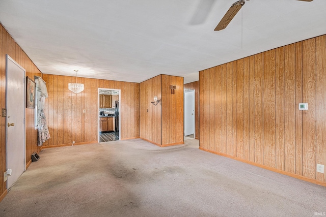 619 Widaman St, Warsaw, IN 46580 - carpeted spare room with wooden walls, ceiling fan, and baseboards