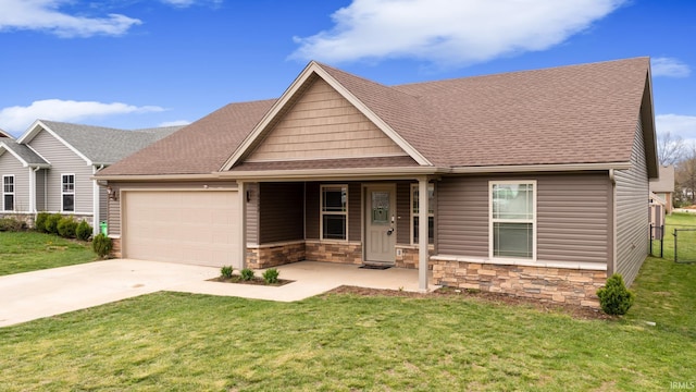 single story home with concrete driveway, a garage, stone siding, and a front lawn