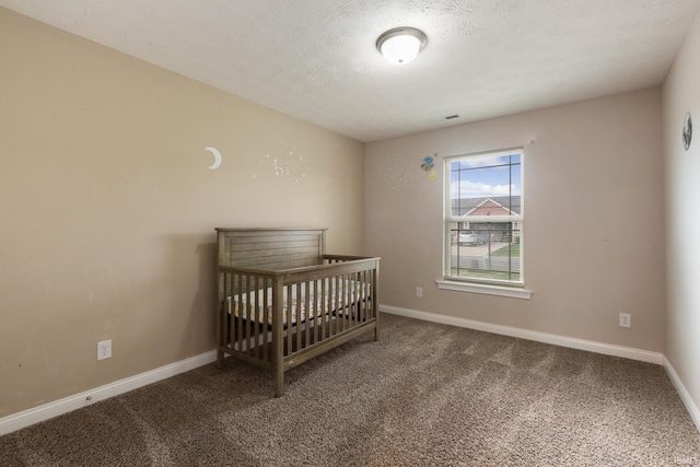 bedroom featuring visible vents, baseboards, and carpet