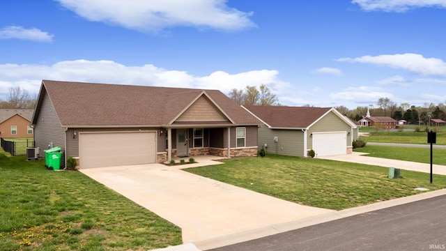 view of front of home featuring a garage, stone siding, driveway, and a front lawn