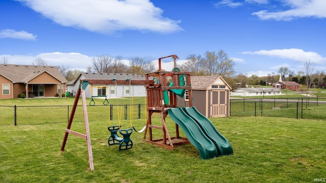 view of playground featuring a yard and fence