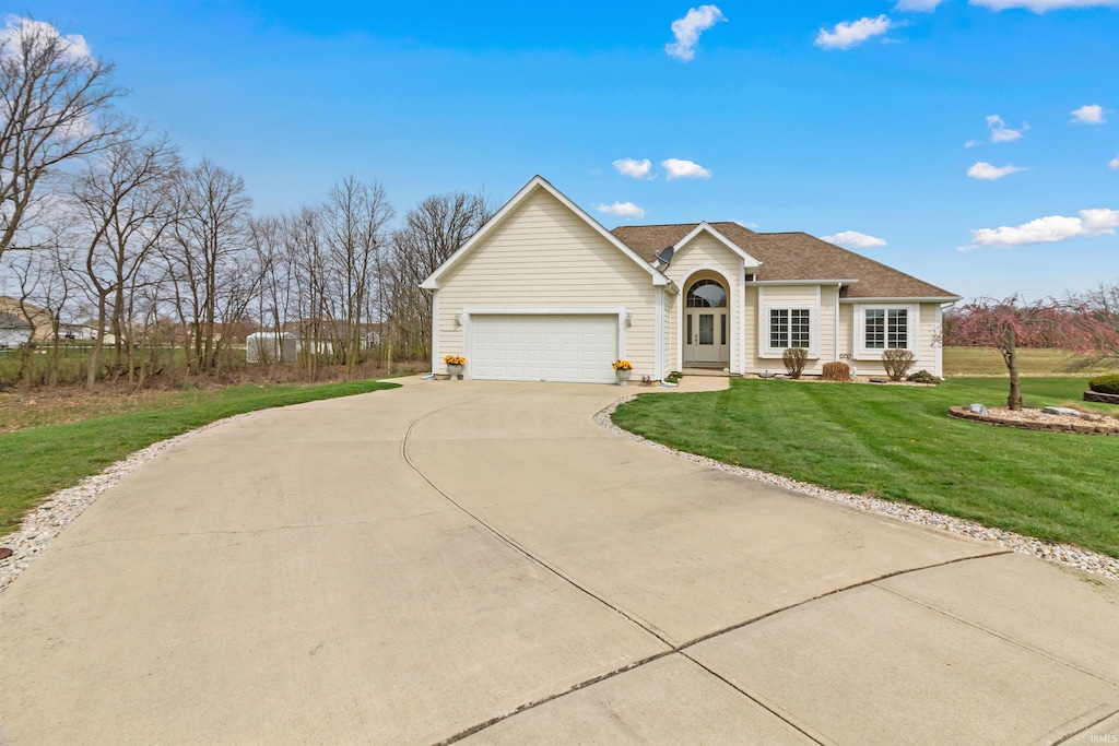 2312 American Dr, Marion, IN 46952 - single story home with a front yard, an attached garage, and concrete driveway