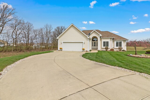 2312 American Dr, Marion, IN 46952 - single story home with a front yard, an attached garage, and concrete driveway