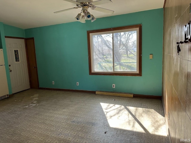 1501 Lafayette St, Valparaiso, IN 46383 - unfurnished room with baseboard heating, baseboards, and a ceiling fan