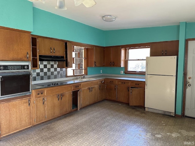 1501 Lafayette St, Valparaiso, IN 46383 - kitchen featuring a sink, brown cabinetry, black appliances, and plenty of natural light