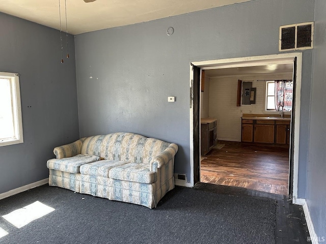 living room with visible vents and baseboards
