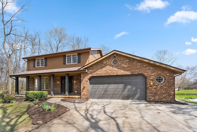 traditional-style house with brick siding, an attached garage, covered porch, and concrete driveway