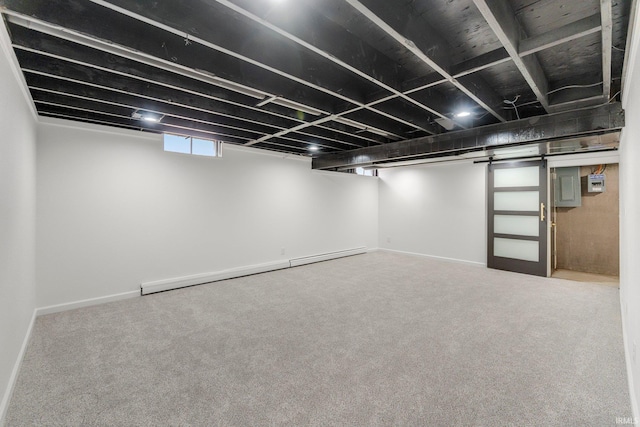 below grade area featuring carpet flooring, a baseboard radiator, and baseboards