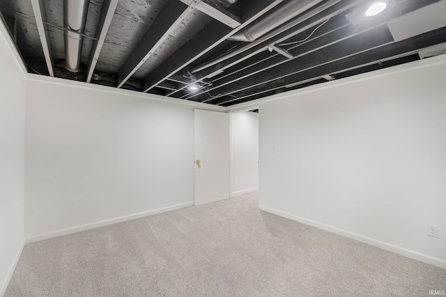 finished below grade area featuring carpet and baseboards