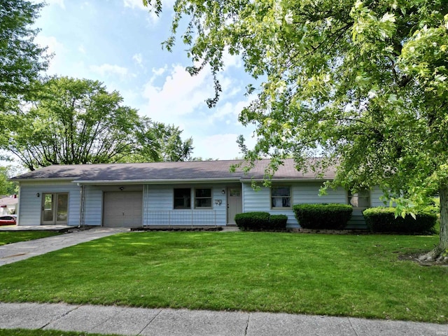 1834 W Kem Rd, Marion, IN 46952 - single story home with an attached garage, driveway, and a front lawn