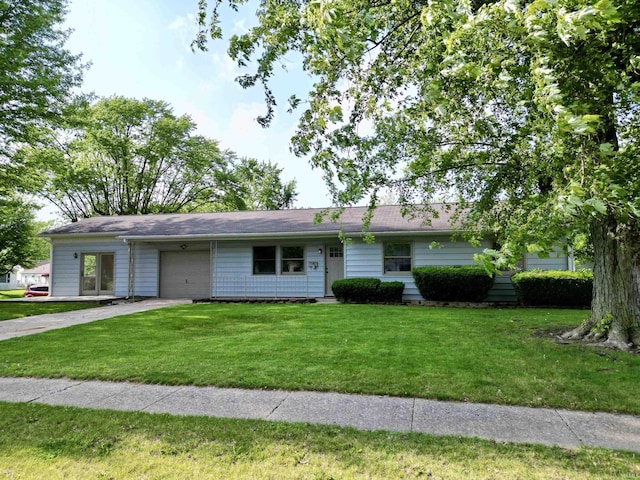 1834 W Kem Rd, Marion, IN 46952 - ranch-style home with a garage, driveway, and a front lawn